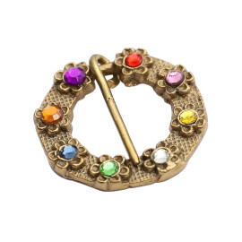 Brass fibula with coloured stones