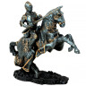 Figure of a knight on horseback with spear and trapper