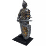 Knight figure with sword and lion shield