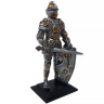 Knight figure with sword and lily shield