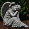 Garden angel 37cm sitting head on knees, grey-green patina