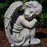 Garden angel 24cm, sitting, head right, grey-green patina