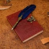 Zápisník s vyraženým pentagramem a oblaky na kožených deskách