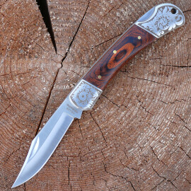 Pocketknife with elegant wooden handle cover with fein decorated bolsters.