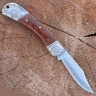Pocketknife with elegant wooden handle cover with fein decorated bolsters.