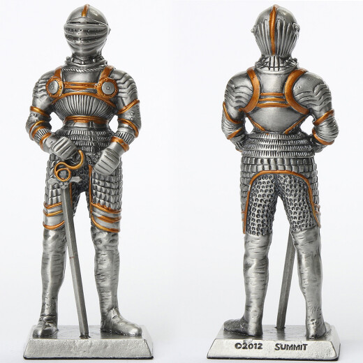 Tin knight statue in gilded armor with besagews