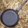 Frying pan with forged handle