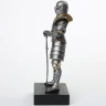 Figure of a knight in chain mail armor and steel full-suit armor