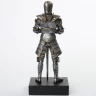 Figure of a knight in chain mail armor and steel full-suit armor