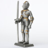Tin knight statue in armor with short lance