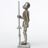 Tin knight statue in tournament armor with sword