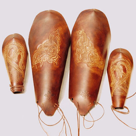 Bracers and greaves with hand-carved patterns